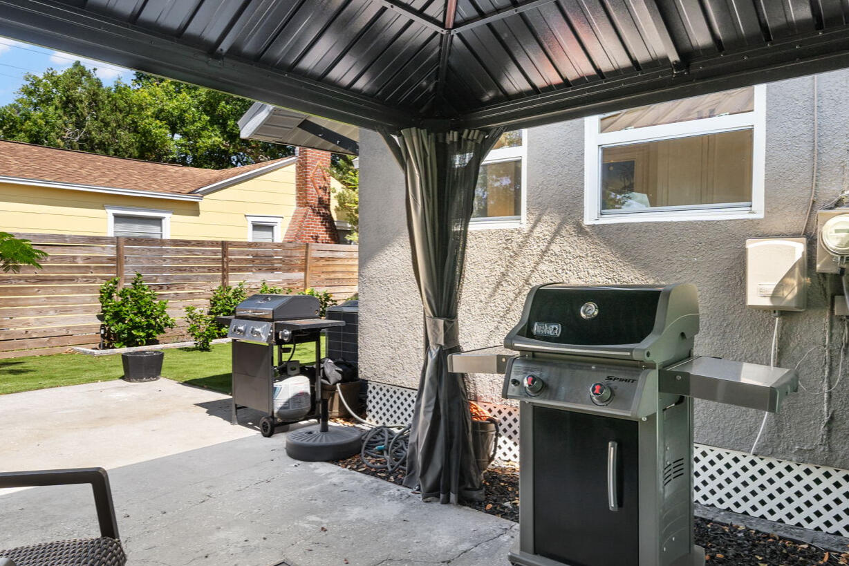 Jasper House covered patio Covered Jasper House patio with outdoor seating and Weber grill
